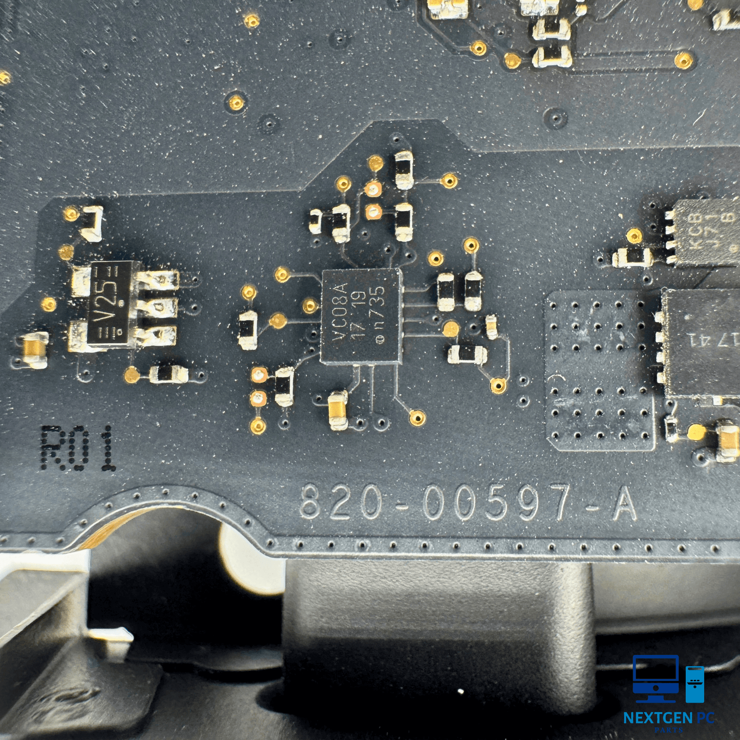 Close-up of iMac 21.5" A1418 logic board 820-00597-A, showcasing circuit components and solder connections.